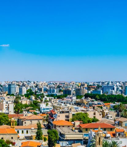 Aerial view of a town with beautiful blue sky on the background