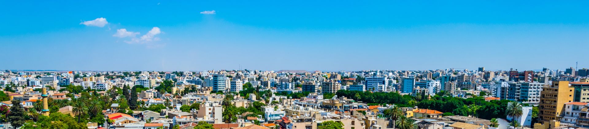 Aerial view of a town with beautiful blue sky on the background
